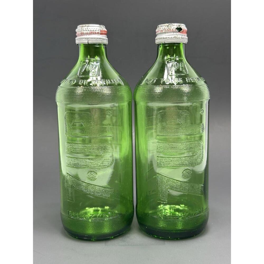 2 Vintage Embossed Green 7UP 16oz Soda Bottle Sideways Logo Aluminum Caps 70s